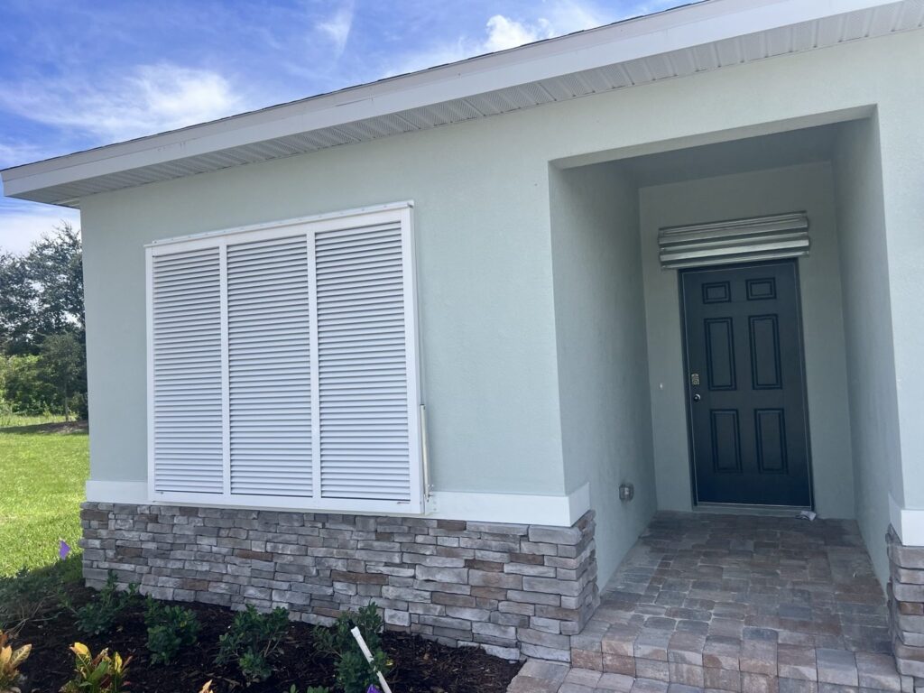 White Bahama shutter installed on a Florida home
