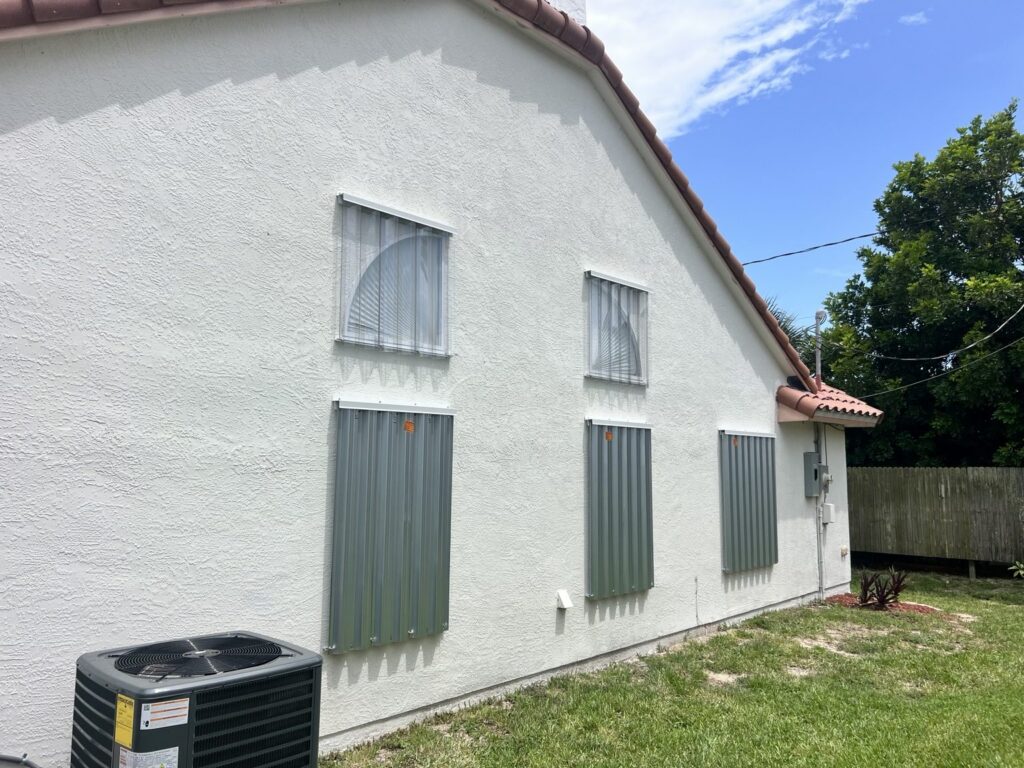 Galvanized steel panels on the first floor and clear Lexan panels on the second floor of the same home