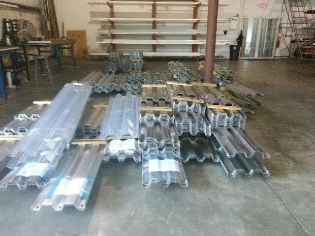 Storm-protection components and extrusions staged inside the HSPM manufacturing shop